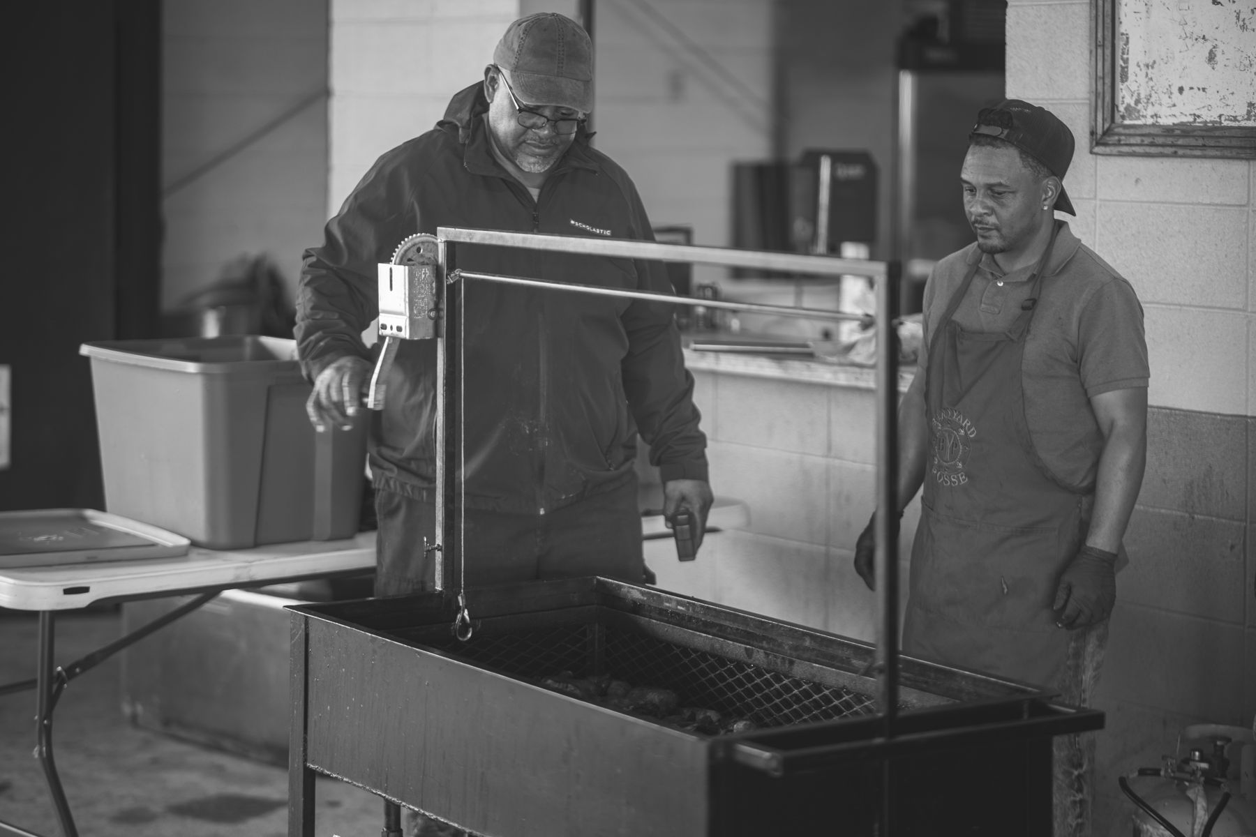 Shane Boagni and an elder at the fryer